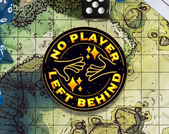 May include: A black and gold round sticker with the text "No Player Left Behind" in a circle around two hands reaching towards each other. The hands are outlined in gold and there are gold stars in the background.
