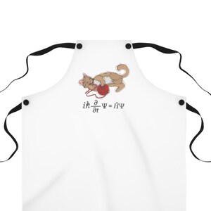 May include: White apron with a black cat illustration and the equation "ih d/dt = f(t)ψ" printed on it. The cat is holding a ball of yarn.