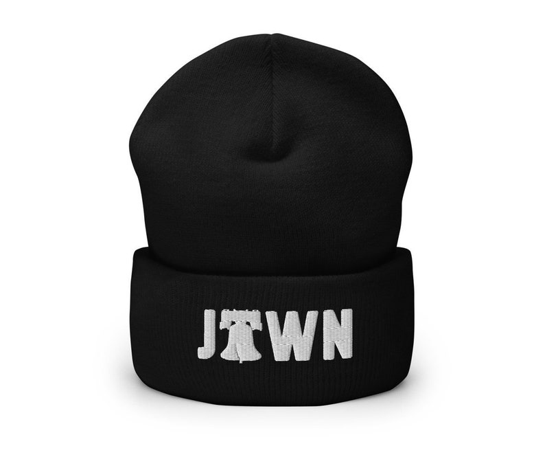 May include: Black beanie with a white embroidered Liberty Bell and the word "Jawn" on the front.