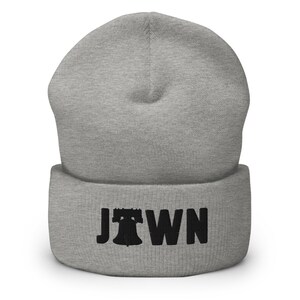 May include: Gray beanie with a black embroidered Liberty Bell and the word "JTOWN" on the cuff.