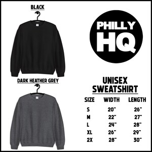 May include: Unisex sweatshirt in black and dark heather grey with the text "PHILLY HQ" in a circle. Size chart shows measurements in inches for width and length.