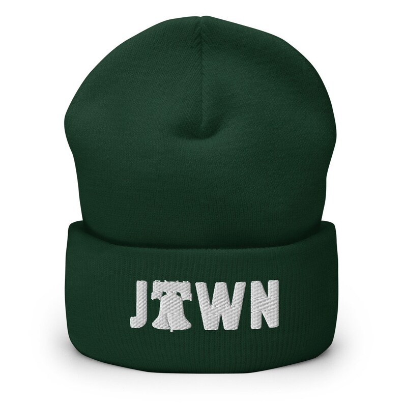 May include: A dark green beanie with a white embroidered Liberty Bell and the word "JTOWN" on the cuff.