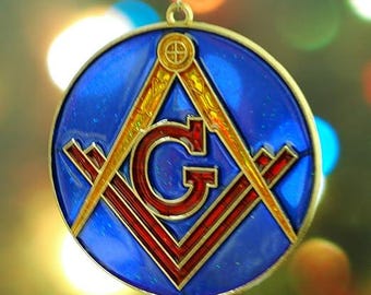 Masons Christmas Tree Ornament made of Glass and Metal. Light shines through ornament