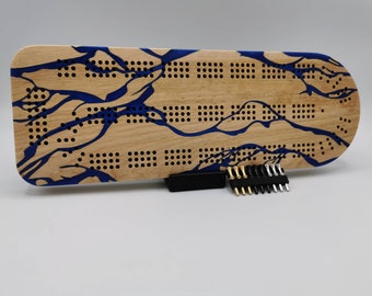 River Series Cribbage Board - Yellow birch wood with a blue epoxy river - Includes metal pegs and custom holder