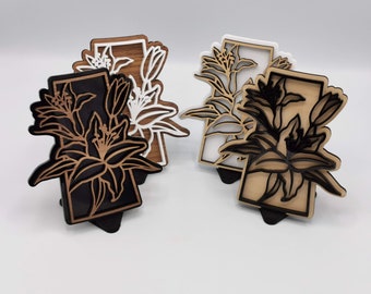 Saskatchewan art - Decorative wood cutout with lilies over the shape of the province