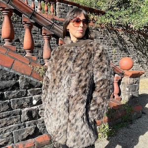 Beautiful Vintage 1980s 80’s GLAM double breasted simulated faux fur animal cat print jacket coat.Small to size 12” vgc