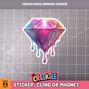 May include: A vibrant sticker featuring a stylized diamond with dripping paint effect. The diamond is rendered in shades of pink, purple, blue, and orange. The text "Various sizes Laminate coating" is at the top. The CreekTee logo and "STICKER, CLING OR MAGNET" are at the bottom.