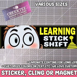 May include: A black and yellow sticker with a cartoon illustration of a person's face with large eyes and the text "LEARNING STICK SHIFT". The sticker is available in various sizes and can be customized with different colors and text.