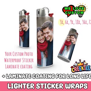 May include: Two lighters with custom photo stickers. The stickers feature a couple in a winter setting. The text on the image reads "Your Custom Photo Waterproof Sticker Laminate Coating + Laminate Coating for Long Life Lighter Sticker Wraps".