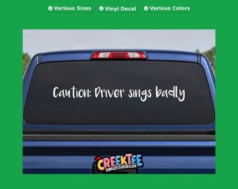 Caution: Driver sings badly vinyl text decal in various sizes, fonts or colors, or choose your own custom text