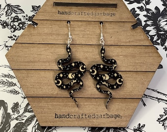 Celestial snake earring, Laser cut and engraved. Iridescent acrylic, Black acrylic, gold paint, rainbow paint. Dangle drop earring.