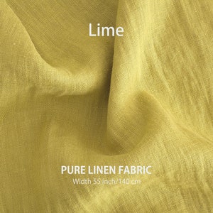 May include: A close-up of a bright lime green linen fabric. The fabric is soft and has a natural texture. The text "PURE LINEN FABRIC" and "Width 55 inch/140 cm" is printed on the fabric.
