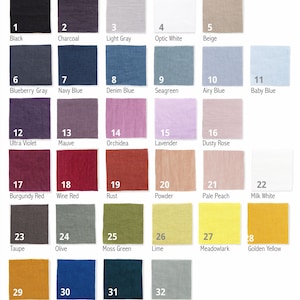 May include: Swatch card with 32 fabric samples in various colors, including black, white, gray, blue, red, green, yellow, and brown. Each sample is labeled with a number and a color name.