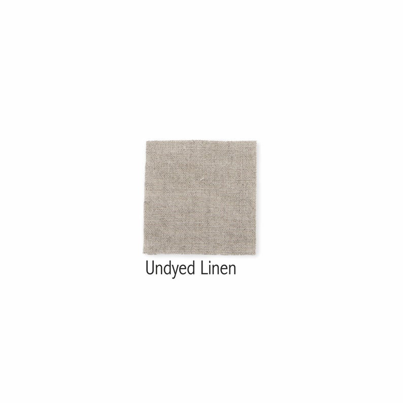 May include: A close-up of undyed linen fabric. The fabric has a natural, off-white color and a slightly textured surface.