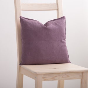 Dusty purple linen pillow case on a chair.