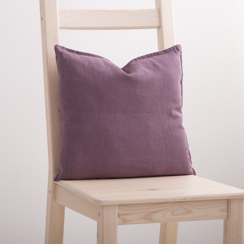 Dusty purple linen pillow case on a chair.