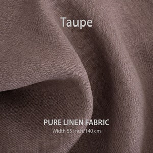 May include: Taupe colored pure linen fabric. The fabric is folded and has a textured weave. The text "PURE LINEN FABRIC" and "Width 55 inch/140 cm" is printed on the fabric.