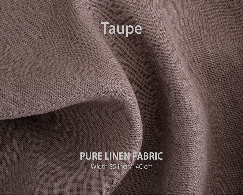 May include: Taupe coloured pure linen fabric. The fabric is folded and has a textured weave. The text "PURE LINEN FABRIC" and "Width 55 inch/140 cm" is printed on the fabric.