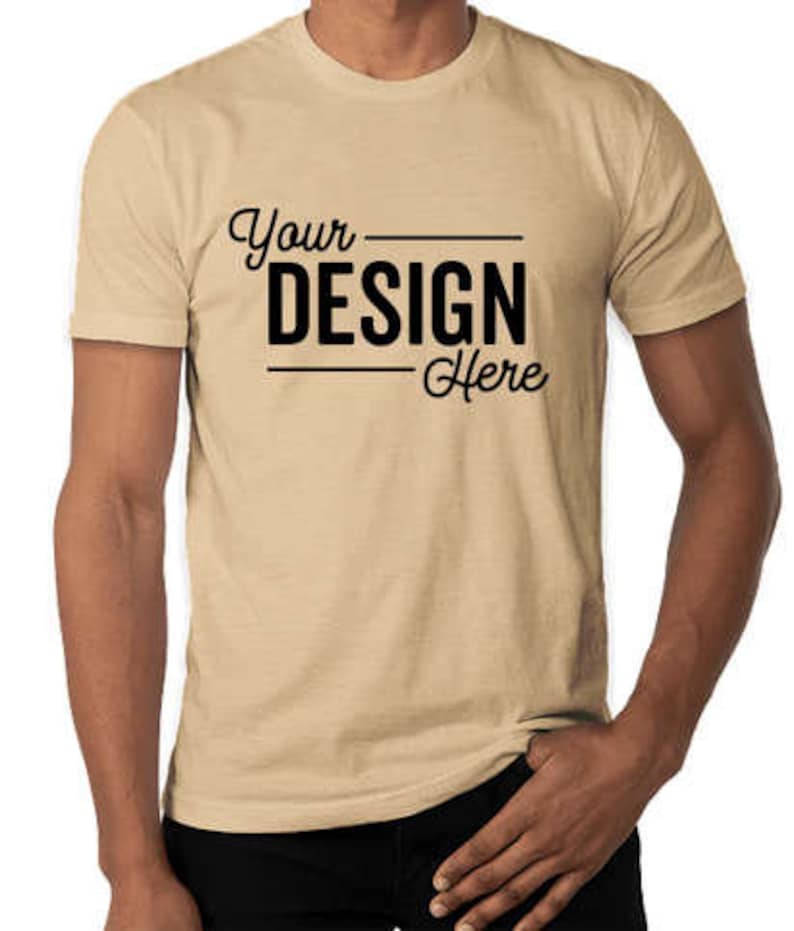 May include: A beige short-sleeved t-shirt with the text "Your Design Here" printed on the front.