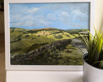May include: A painting of a green, rolling landscape with a stone wall in the foreground. The sky is blue with white clouds.