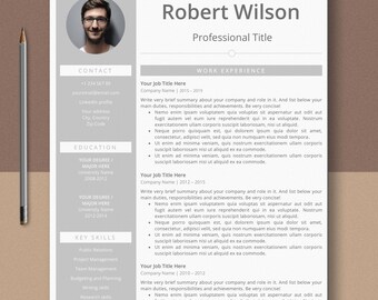May include: A professional resume template with a headshot, contact information, education, key skills, and work experience sections. The resume is primarily white with gray accents and black text. The name "Robert Wilson" is at the top.