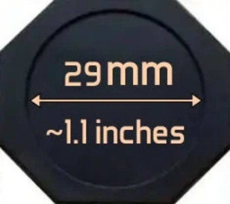 May include: A black octagonal-shaped object with a white circle in the center. The circle has the text "29 mm" and "~1.1 inches" printed in white.