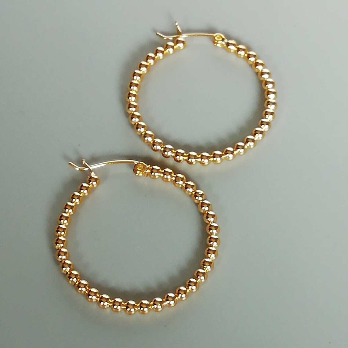 gold hoops with diamond balls