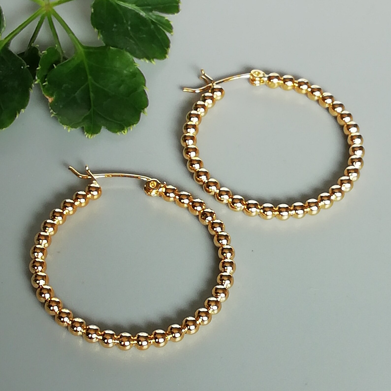 gold hoops with diamond balls