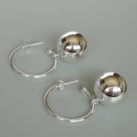 Silver hoop with ball earrings best sale
