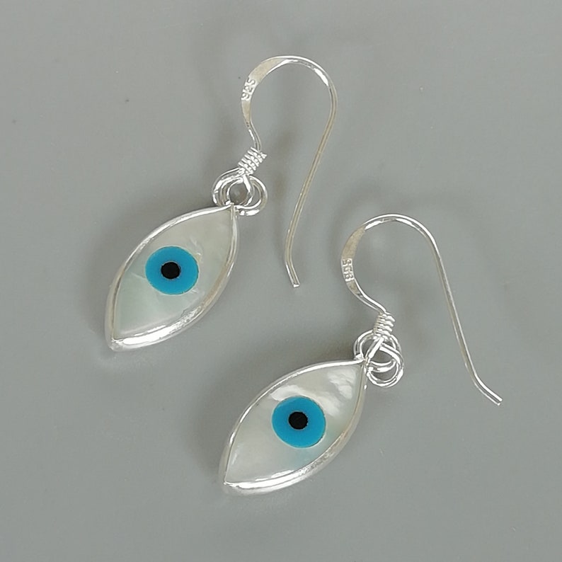Silver and Blue Brass Metal Evil eye Danglers main image 0