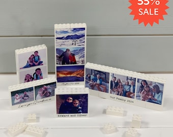 May include: A collection of white interlocking building blocks featuring custom printed photographs on the front surfaces. The blocks are arranged in various rectangular configurations, displaying family images and text including Love you Grandma xx, Anything Feb 2024, Edward and Oliver, and Our Family 2024.