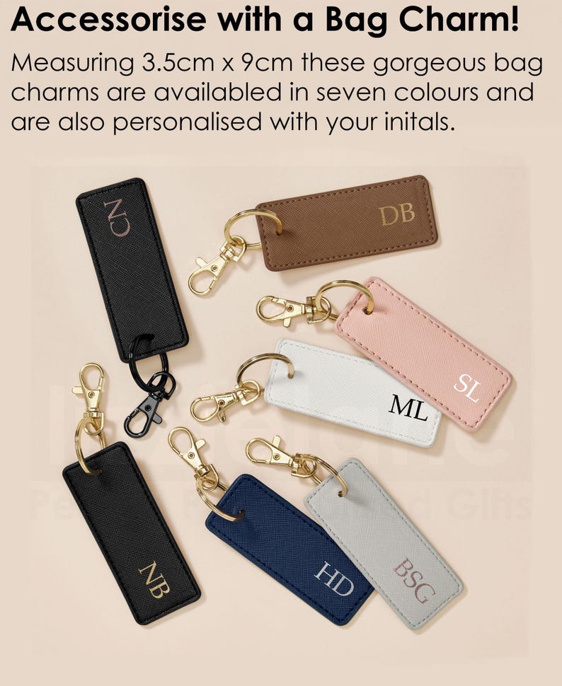a collection of personalized bag charms, each with a unique initial printed on it. The charms are available in various colors and are designed to be attached to bags or accessories.
