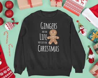 Puede incluir: Una sudadera negra de cuello redondo con un gráfico de un hombre de jengibre marrón y el texto en blanco: Gingers are for life not just for Christmas. El diseño está centrado en la parte delantera de la prenda de manga larga.