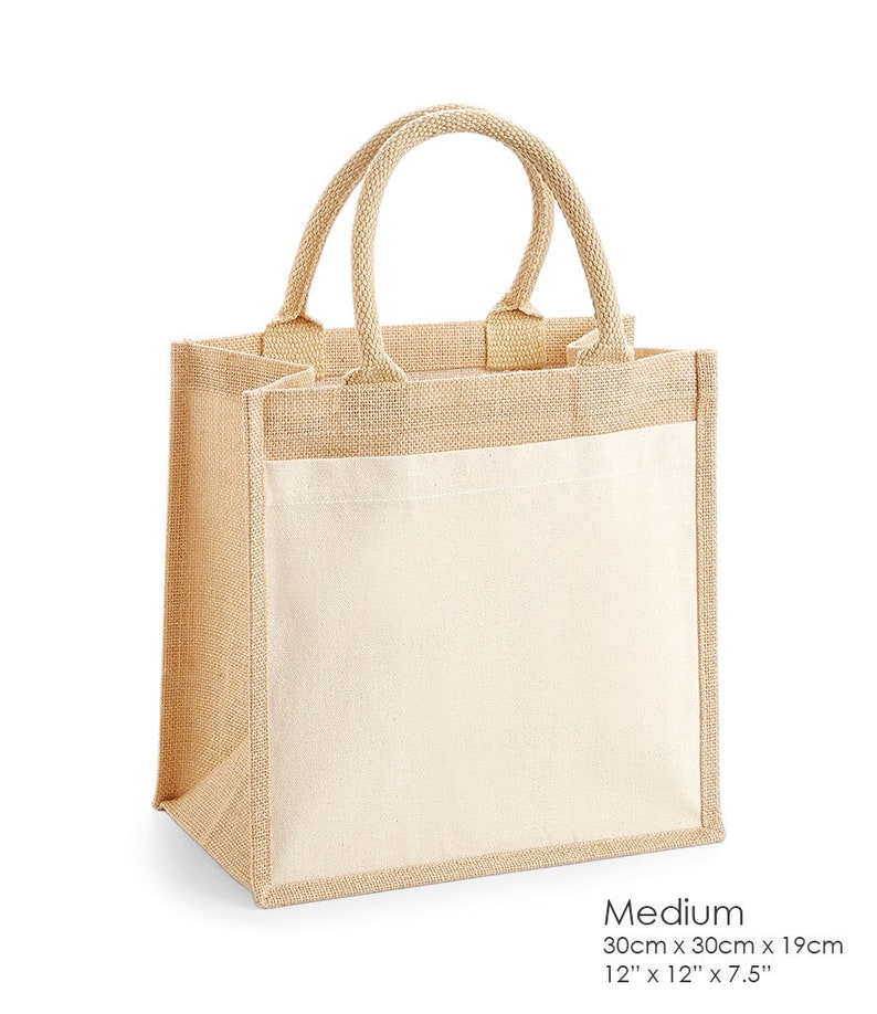 May include: A medium-sized jute tote bag with a natural brown color. The bag has a white cotton fabric panel on the front. The bag measures 12 inches by 12 inches by 7.5 inches.