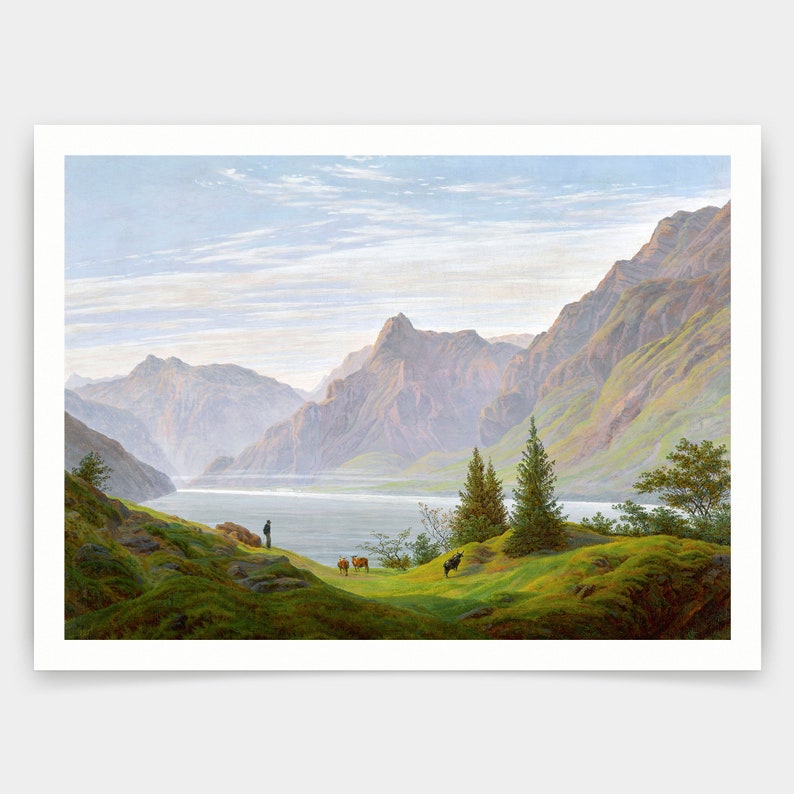 May include: A painting of a mountain lake scene with a man standing on a grassy hill overlooking the water. The lake is surrounded by mountains and there are a few trees in the foreground. The sky is blue and there are some clouds.
