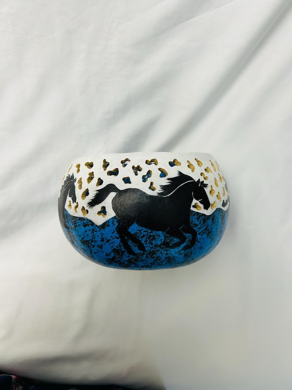 Playful horses bowl