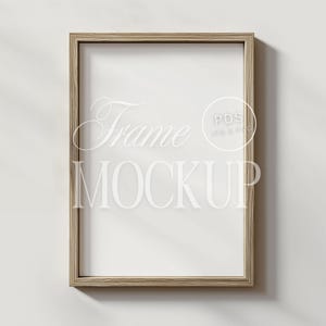 May include: A light wood frame mockup with a white background. The frame is empty and ready for your design.