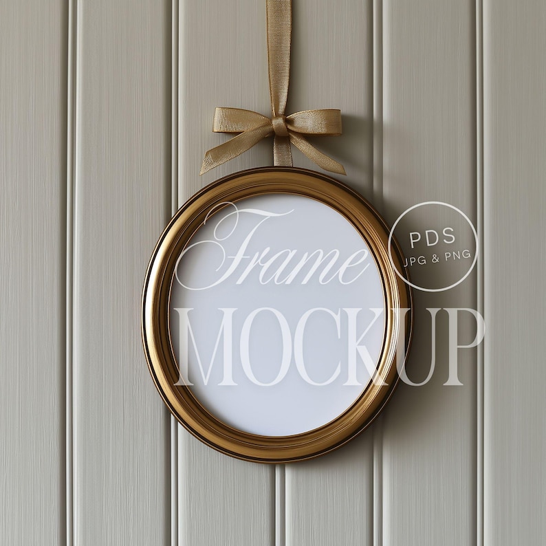 a picture frame hanging on a wall with a bow