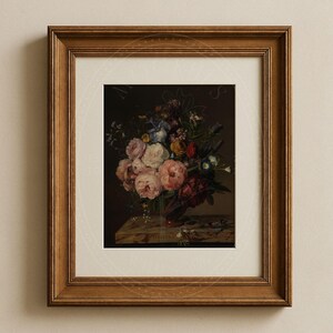 May include: A framed painting of a still life featuring a vase filled with a variety of colorful flowers, including pink roses, blue irises, and yellow blossoms. The vase is on a marble pedestal and the background is dark.