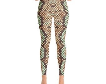 May include: Full-length leggings with a reptile scale pattern in shades of brown, tan, and mint green. The leggings have a high waist and a close fit, ideal for yoga or other activities.