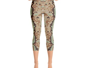 May include: A pair of brown, green, and beige yoga leggings with a snake skin pattern.