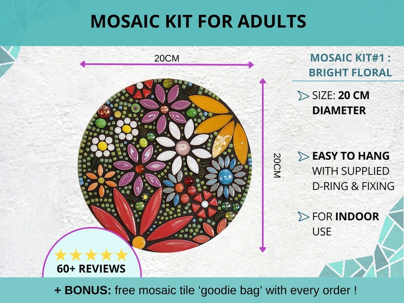 Finished mosaic kit with floral design hanging on a white wall, with arrows and dimensions explaining its size of 20cm diameter, that it is for indoor use only and that there is d-ring supplied for easy hanging.