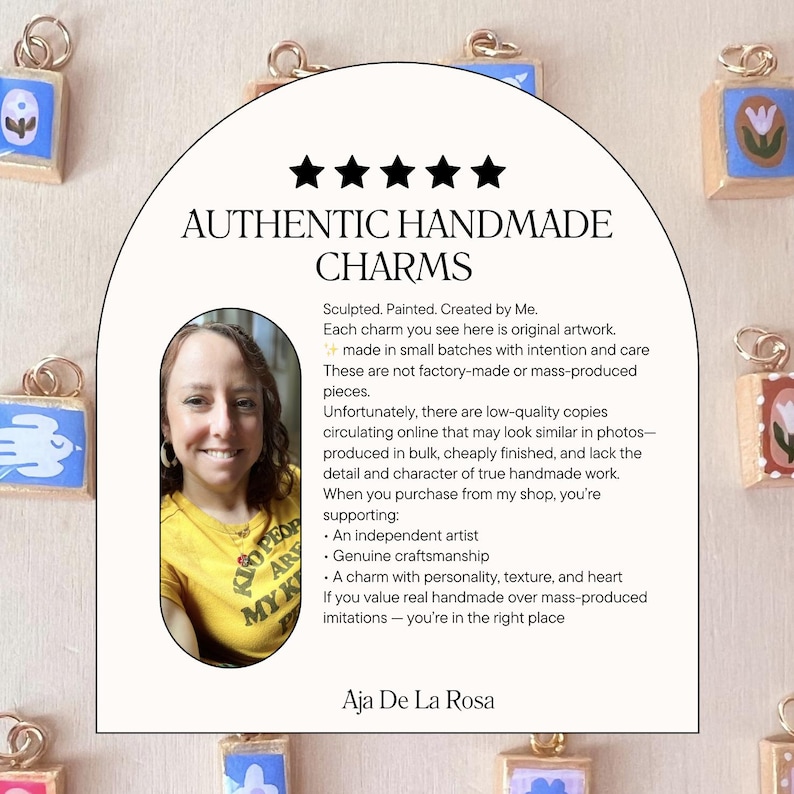 May include: A collection of small, square, hand-painted charms with gold-toned jump rings, arranged around a central arch-shaped sign. The sign features five black stars, the text AUTHENTIC HANDMADE CHARMS, a portrait of an artist, and descriptive text.