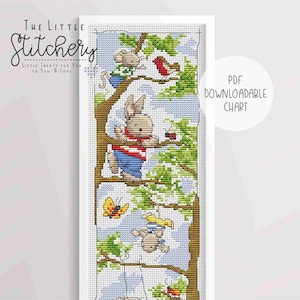May include: Cross stitch pattern featuring a bunny, a mouse, and a bird on a tree branch. The pattern is titled "The Little Stitchery: Little Treats for You to Sew & Love".