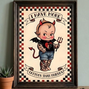 May include: Framed artwork depicting a cartoon baby with devil horns, wings, and a trident. The baby is heavily tattooed and wears a black shirt and blue shorts. The banner text reads "I HAVE MORE TATTOOS THAN FRIENDS."
