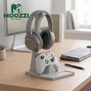 May include: A light gray 3D printed stand designed to hold gaming accessories. The stand features an arched top hook for resting over-ear headphones and a lower cradle for a white game controller, providing a stable base for desk organization.
