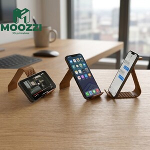 May include: Three brown, textured, 3D-printed smartphone stands arranged on a wooden surface. Each stand features a triangular, angled design with a cross-hatched pattern on the base and back support, holding smartphones in various orientations.