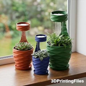 May include: Three decorative self-watering planters in orange, blue, and green, each with a unique design. The planters sit on a wooden windowsill in front of a window. The text "3DPrintingFiles" is visible at the bottom.