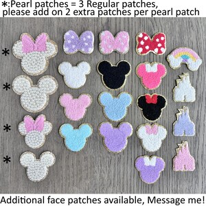 May include: A collection of 18 iron-on patches featuring various designs, including Mickey Mouse faces, bows, and rainbows. The patches are arranged in rows on a wooden surface. The text "*:Pearl patches = 3 Regular patches, please add on 2 extra patches per pearl patch*" is visible at the top of the image. The text "Additional face patches available, Message me!" is visible at the bottom of the image.