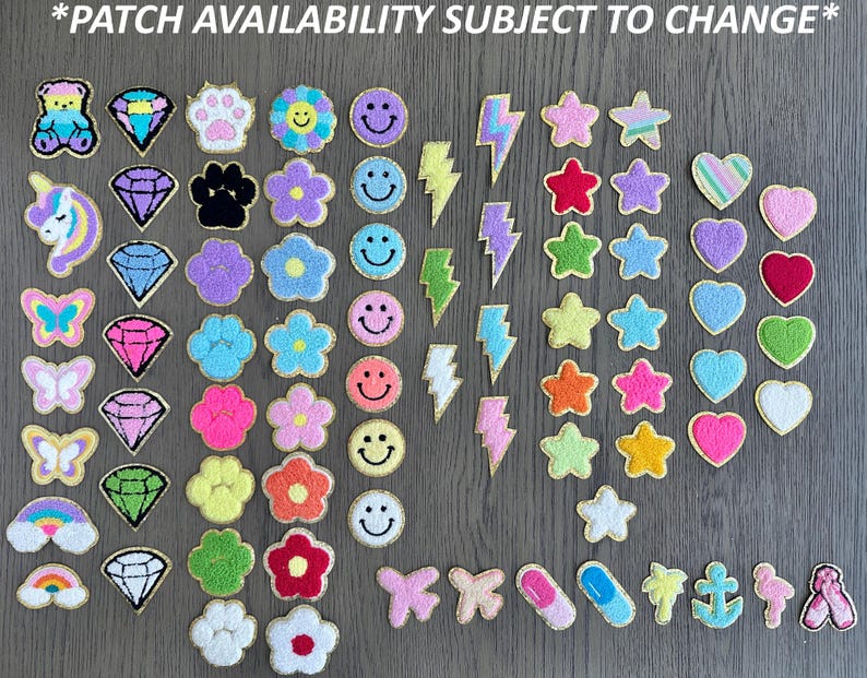 May include: A collection of colorful iron-on patches featuring various designs, including animals, hearts, stars, flowers, and smiley faces.  *PATCH AVAILABILITY SUBJECT TO CHANGE*
